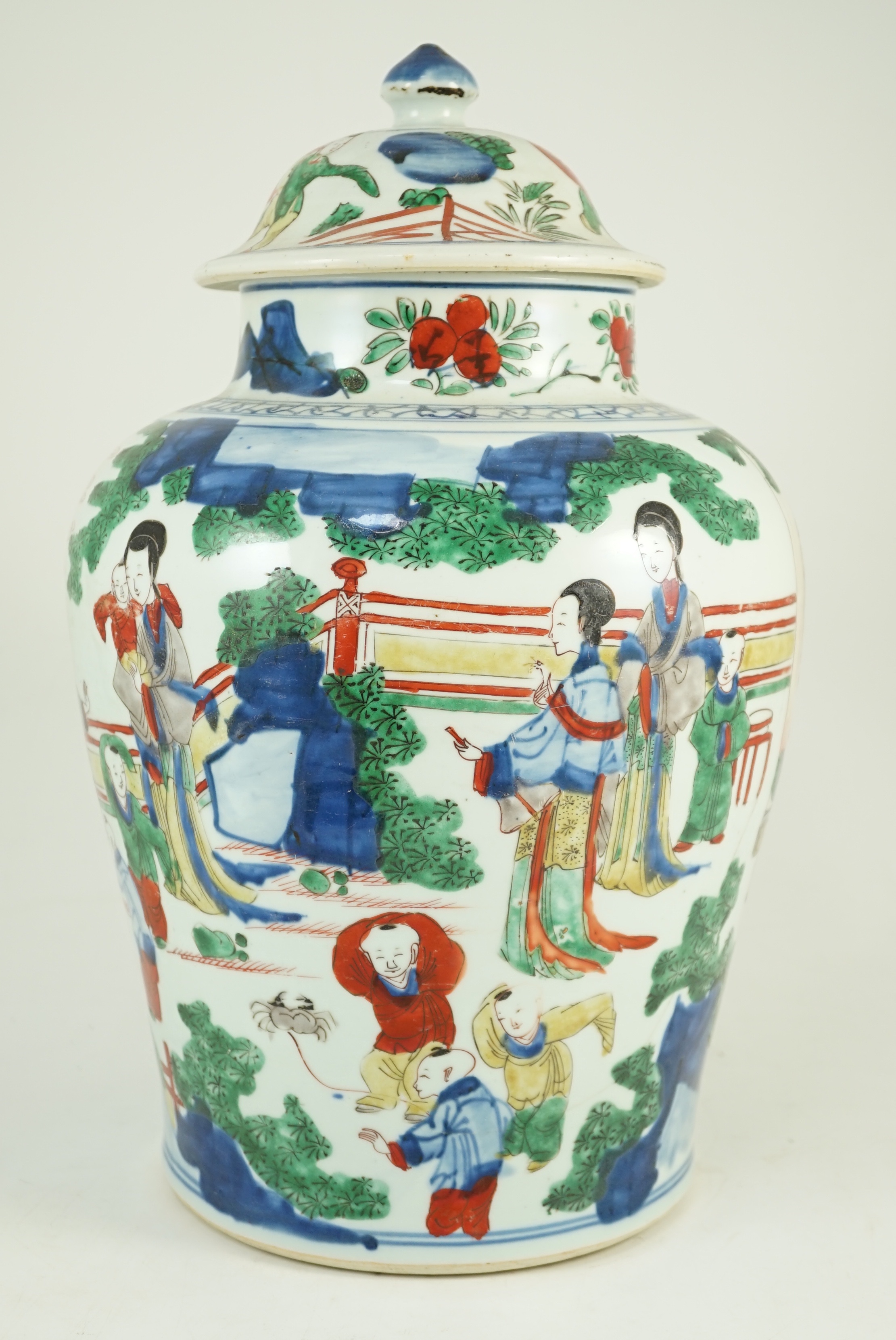 A Chinese Transitional wucai 'boys' vase and cover, c.1640, 41cm high